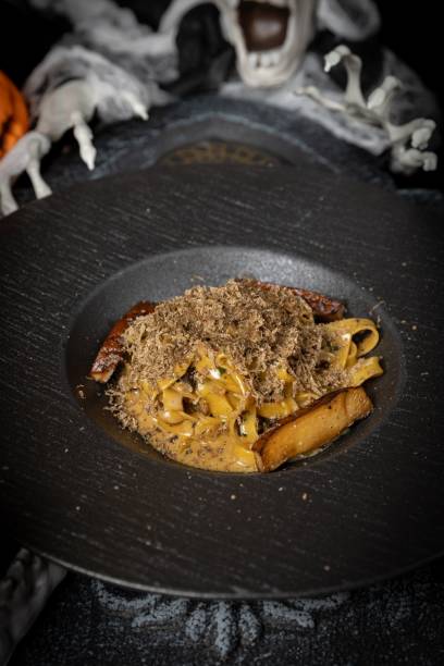 istock Pasta with truffle in a moody setting 2181458353