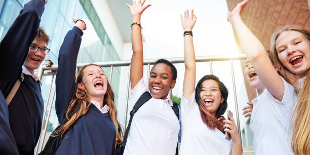 istock Group of diverse students, celebrating together. 2181458508