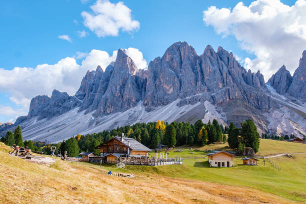 istock Majestic Dolomites landscape featuring rustic cabins and towering peaks in autumn sunlight 2181458643