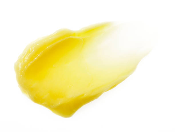 istock Yellow color skincare balm on background 2181459619