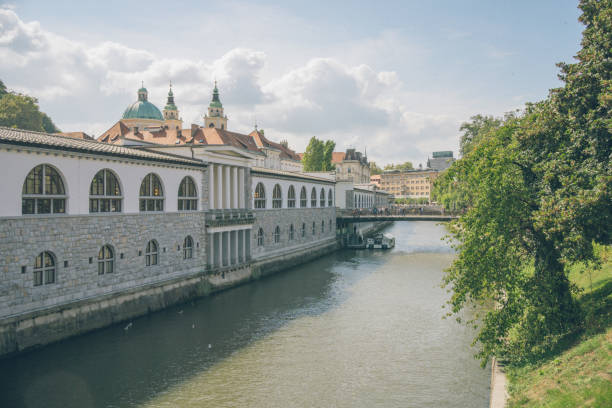 istock View down river flowing past old city and forest 2181461315