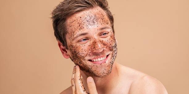 istock Young Caucasian man enjoying a facial scrub. 2181463209