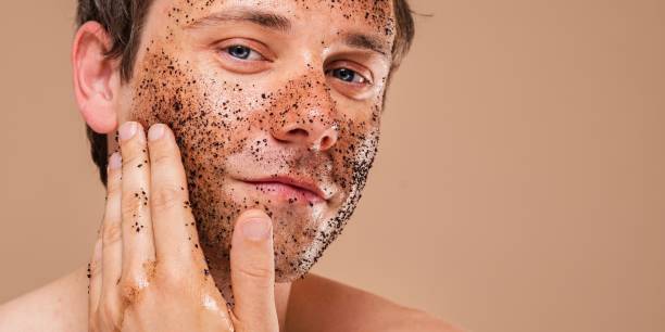 istock Caucasian man applying a facial scrub. 2181463249