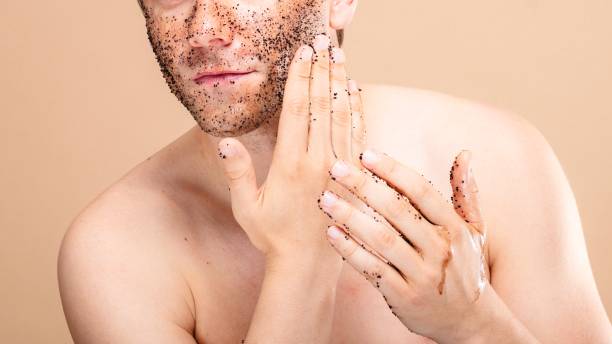 istock Caucasian man applying facial scrub. 2181463322