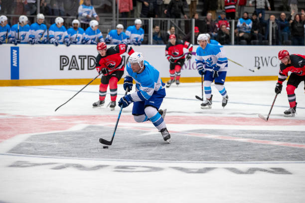 istock Ice Hockey Player Leading the Attack in Intense Match 2181463843
