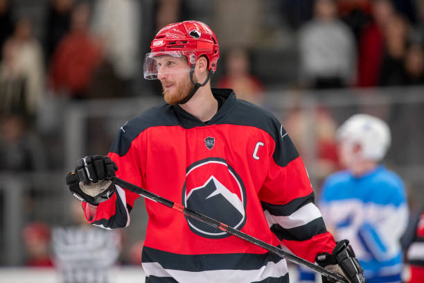 istock Ice Hockey Team Captain in Red and Black Uniform 2181463894