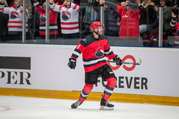 istock Excited Ice Hockey Player Celebrates on the Ice 2181464006