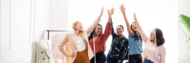istock Group of diverse women celebrating success. 2181466060