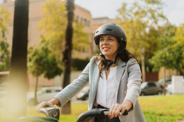 istock Woman walking with a bike 2181466295