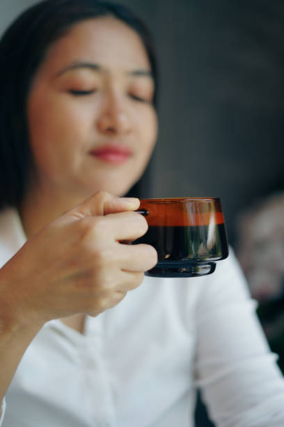 istock A woman is drinking coffee in the morning. 2181471856
