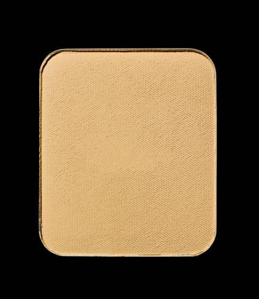 istock Foundation powder makeup in container shape on black background 2181472860