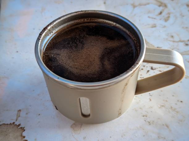 istock The photo shows a cup of coffee with grounds floating on top. 2181472963