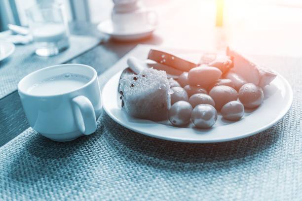 Healthly food. Continental breakfast in hotel room or bed. Fried eggs with sausages. Cup of coffee. Menu template. Cookery. Cooking. Romantic french or rural breakfast on Valentine