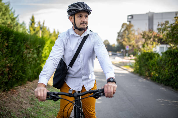 istock Close-up of young handsome bearded man who is going to work by bicycle. 2181473532