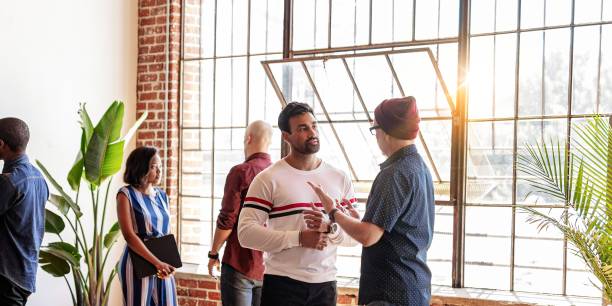 istock Diverse group of people in casual modern office, discuss ideas. 2181475545