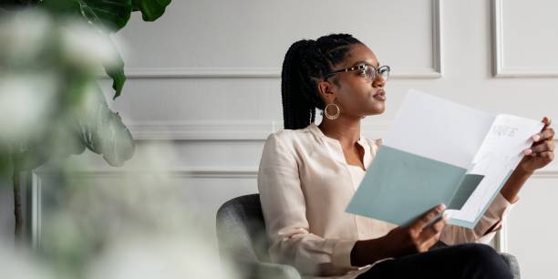 istock African American businesswoman reading a document. 2181475622