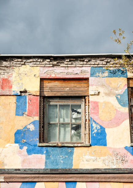 istock Old wooden rustic window on the ancient industrial abandoned house 2181475658