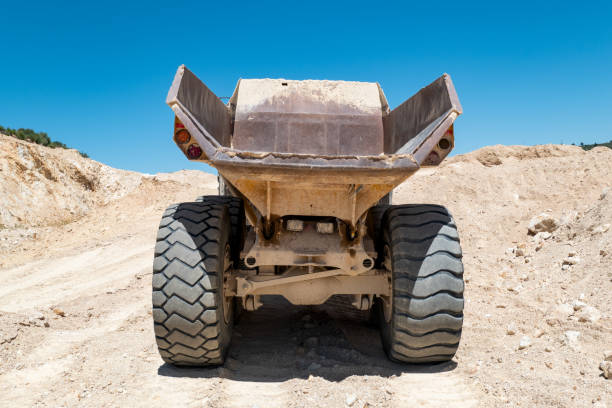 istock A giant truck and hard work in the quarry 2181476425