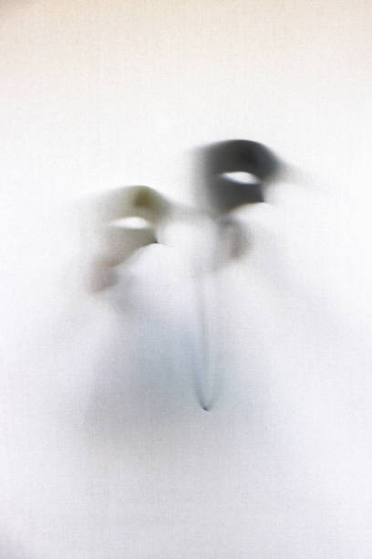 istock Abstract Phantom of the Opera mask behind the curtain. 2181477677