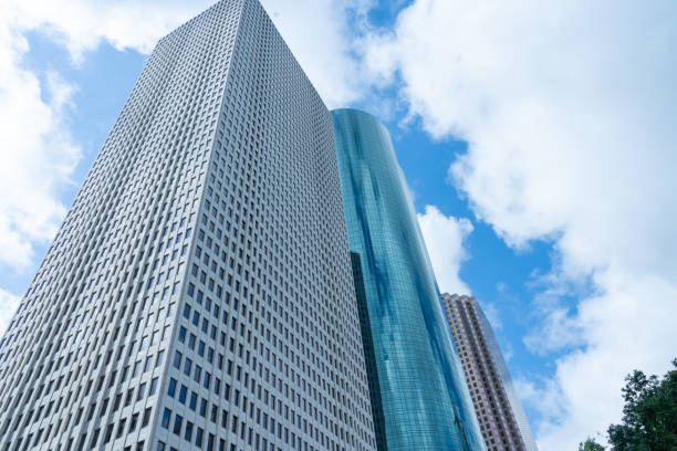 Looking Up  high-rise office buildings with blue sky in the background in Houston.