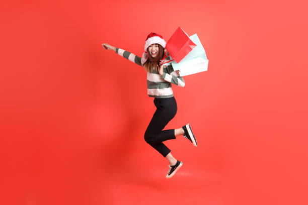 istock Woman wearing Santa hat 2181478858