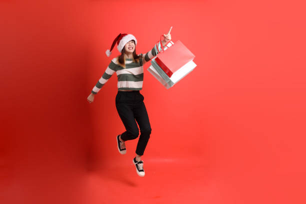 istock Woman wearing Santa hat 2181478863