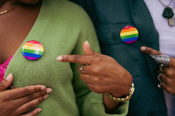 istock Activists showing their LGBTQIA+ rainbow pin 2181482758