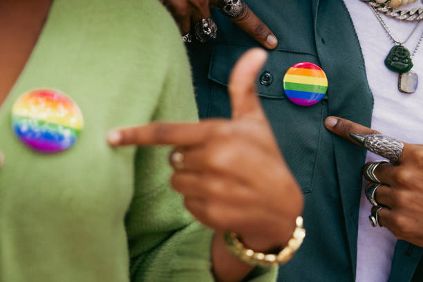 istock Activists showing their LGBTQIA+ rainbow pin 2181482775
