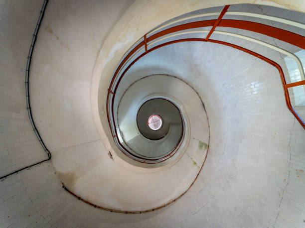 Stairway leading to a bright light in a dark room