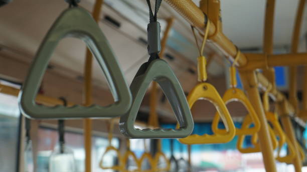istock Yellow and grey handrail ring for standing passenger inside a bus 2181484137
