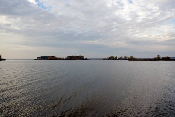 Spaces above the lake. High sky, sunset. Horizon. Autumn evening, quiet and fine. Reflection.