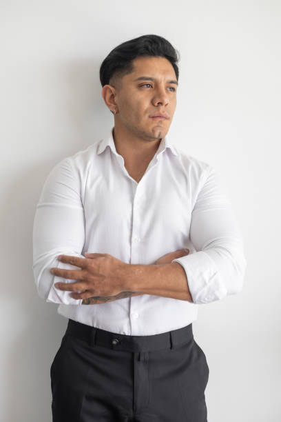 istock young man wearing a white shirt, studio photo with formal clothes 2181484833