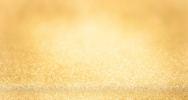 istock Shiny gold glitter texture background with blurred bokeh lights. Abstract festive background with soft focus. 2181484971