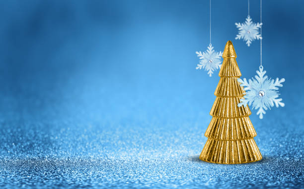 istock Gold Christmas tree and hanging snowflake on shiny glitter blue background with bokeh light. Festive winter holiday decoration and ornament. 2181485010