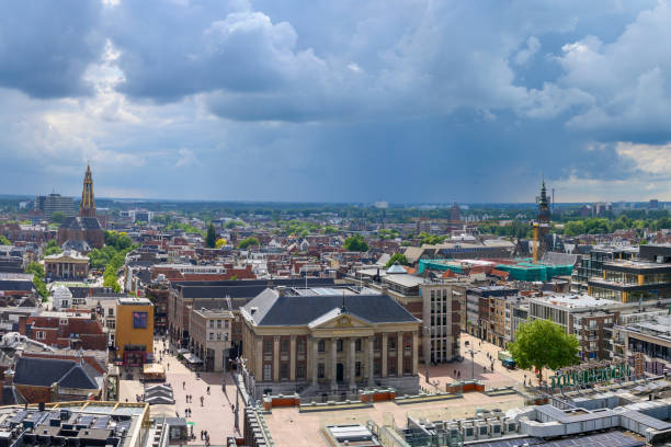 Panoramic view over the city of Groningen in The Netherlands from the Forum cultural center with a dramatic sky above.