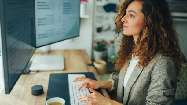 istock Businesswoman at home working on standing desk 2181486841