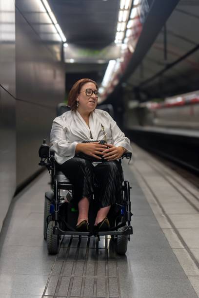 istock Inclusive Transport: Woman in Wheelchair at Metro Platform 2181490537