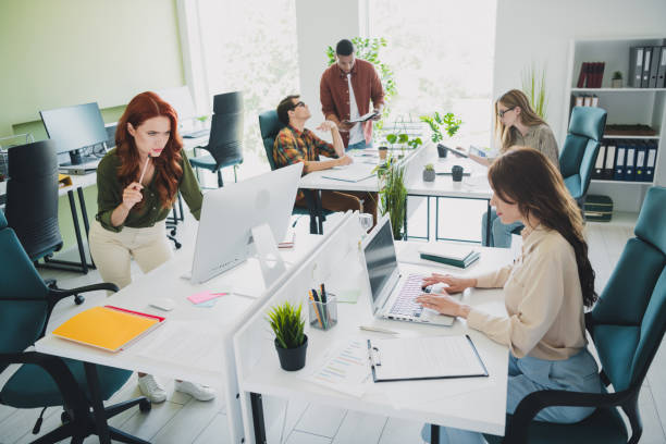 istock Photo of group young corporate workers develop project workstation office business center indoors 2181491089