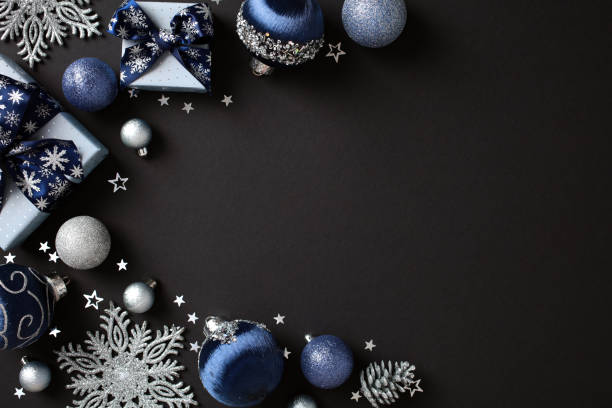 istock Elegant blue and silver Christmas decorations, gift boxes, snowflakes on dark background. Xmas banner design. Flat lay, top view, copy space. 2181495805