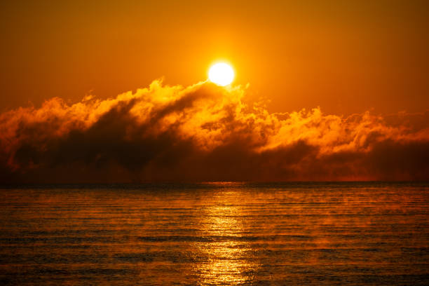 The sun is going up over the golden sea