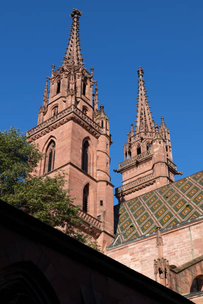Basel Minster (Basler Munster) Cathedral towers and tiled roof in Basel, Switzerland.