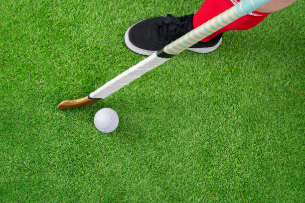 istock hockey player hitting the ball with the stick 2181504223