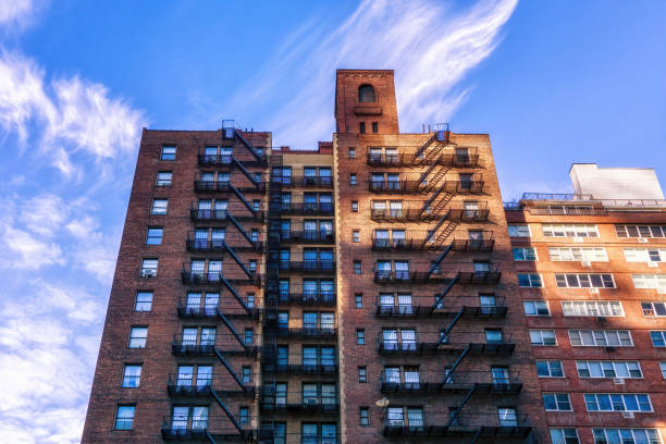 New York brick buildings with outside fire escape stairs, USA