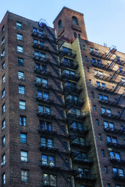 istock New York brick buildings with outside fire escape stairs. 2181504843