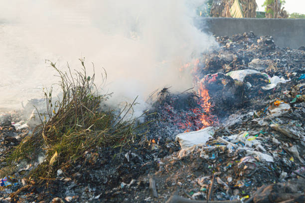 istock Burning of garbage in garbage dumps. which causes smoke pollution disease.Air pollution, environmental problems,Respiratory disease. Focus on smoke. Noise. Exposure. Similar others 2181506356