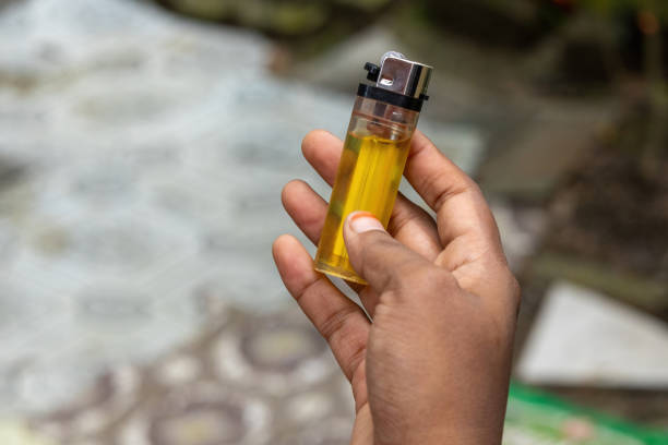 istock Female hand holding a plastic gas lighter. 2181507029