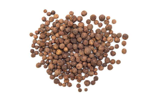 istock Black peppercorns isolated on white background, top view 2181519842