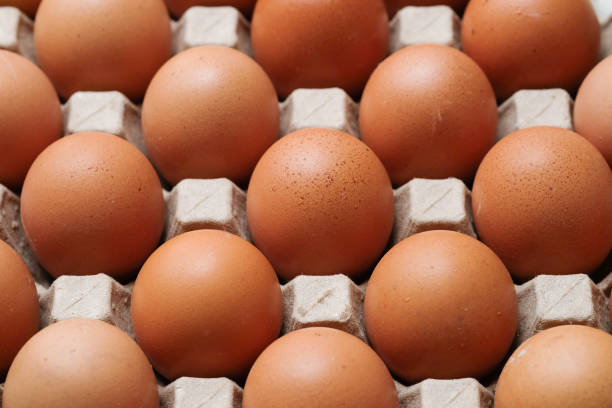 istock Fresh eggs in a brown paper egg tray. 2181522946