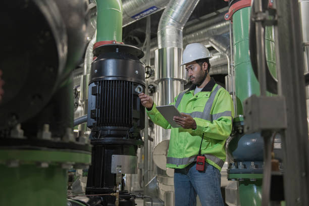 istock Technician worker working in chiller plant room. 2181524473