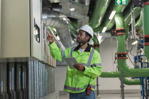 istock Technician worker working in chiller plant room. 2181524585